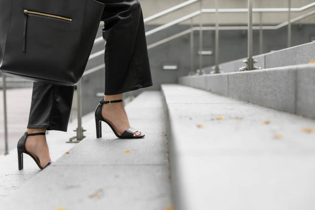 woman walking in heels up steps